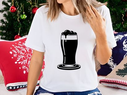 Spilling dark beer in a pint glass