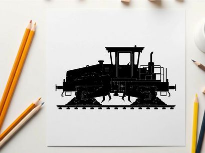 Silhouette of a caterpillar tractor on railroad tracks