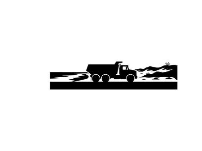 Silhouette of a truck driving on a road with mountains