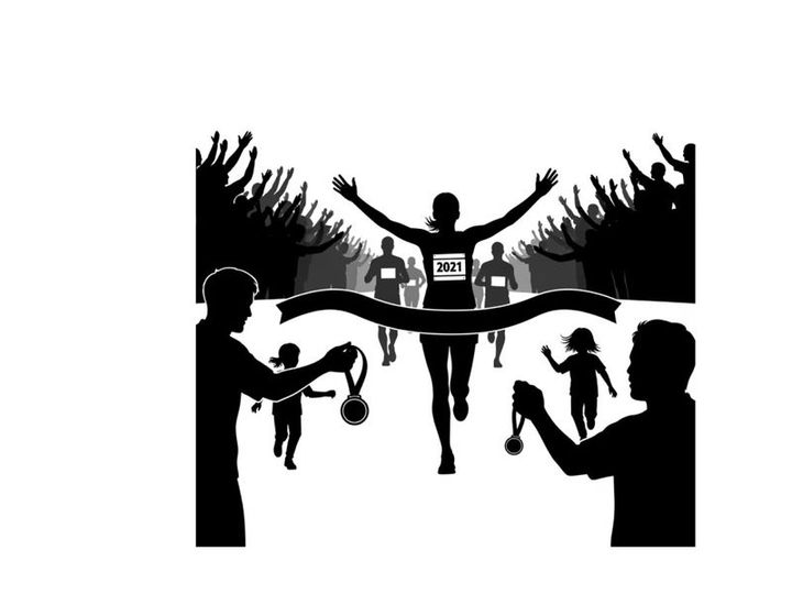 Victorious runner crossing finish line in silhouette