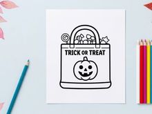 Halloween trick or treat candy bucket with jack-o-lantern. Festive kids pumpkin candy bag for spooky holiday celebrations and parties.