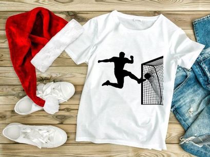 Soccer goalkeeper diving to block a shot on goal in a football match