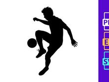 Silhouette of a soccer player kicking a ball in mid action
