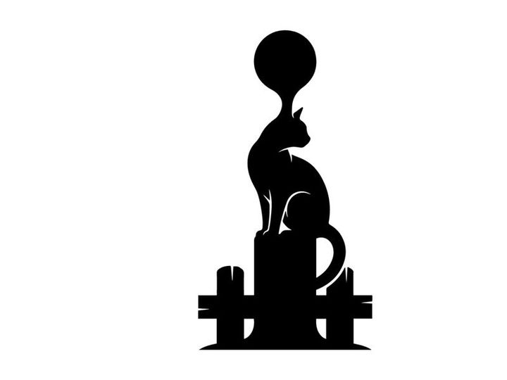Silhouette of a cat with a balloon on its head sitting on a fence at sunset