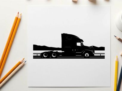 Silhouette of a semi truck driving on a highway with mountains