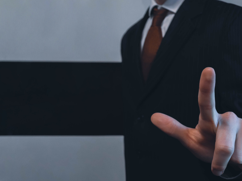 Businessman pointing with finger closeup concept image