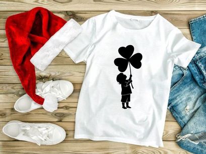 Child holding heart balloons joyful outdoor celebration silhouette