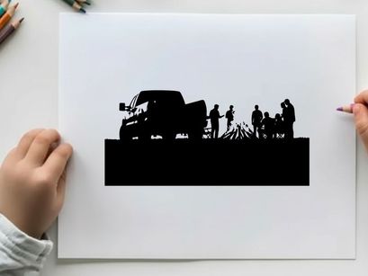 Silhouette of people gathered around campfire beside a truck