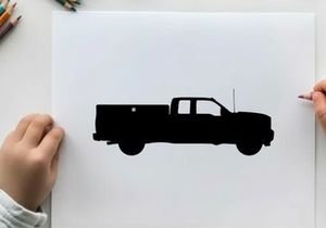 Silhouette of a pickup truck against a white background
