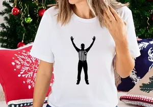 Referee signaling a call or penalty in a sports game with arms raised high