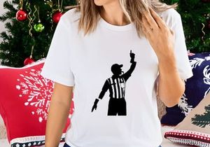A black silhouette of a referee signaling a penalty in a sporting event