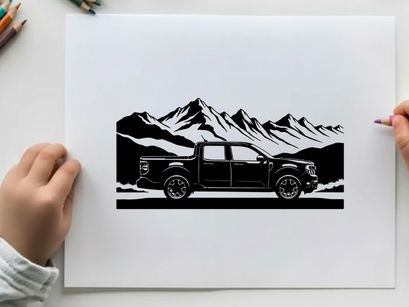 Silhouette of a pickup truck in front of a mountain range silhouette
