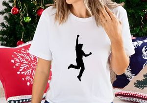 A silhouette of a person jumping up in the air with one arm raised