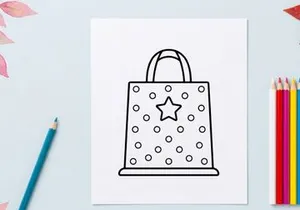 Halloween themed gift bag with star pattern. Festive trick or treat candy tote for seasonal celebrations.
