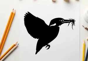 Silhouette of a bird in flight with twigs in its beak