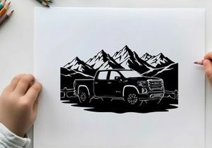 Silhouette of a pickup truck in front of mountains