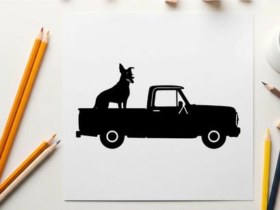 Silhouette of a dog sitting in the back of a pickup truck