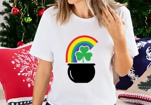 Lucky pot of gold with rainbow and shamrocks in black cauldron
