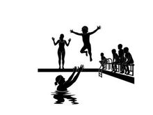 Silhouette of children playing and jumping into a swimming pool
