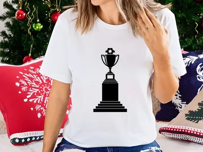 A black and white image of a trophy cup on a pedestal base with soccer ball