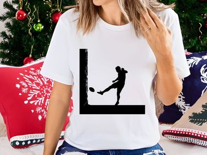 Silhouette of a person kicking an american football in a dynamic pose