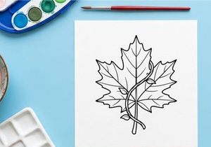 Cozy autumn scene with a warm blanket and fall leaves. Relaxing outdoor setting for seasonal lifestyle imagery.