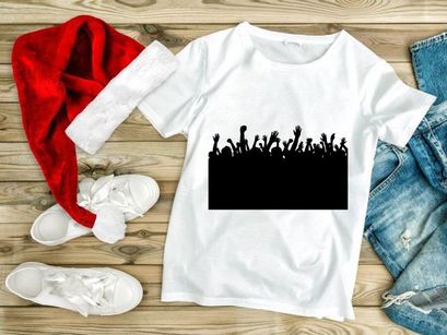 A crowd of people with raised hands in a celebratory or protesting atmosphere at an event