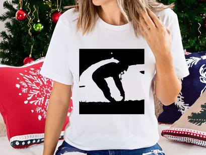 Man bending down in a field at sunset with a serene and peaceful atmosphere