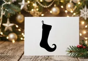 Black Christmas elf stocking silhouette isolated on a white background