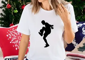 Silhouette of a female soccer player kicking a ball with dynamic movement
