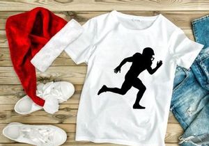 A black silhouette of a person running with a football helmet on their head