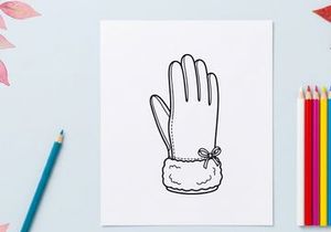 Handmade Christmas glove puppet with white yarn and bow for festive holiday crafts