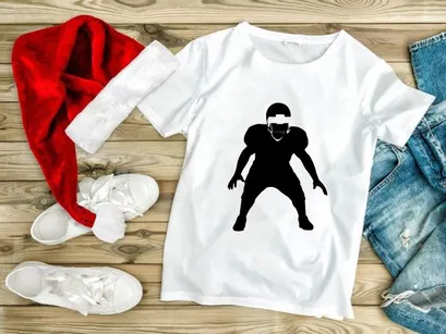 American football player in defensive stance silhouette