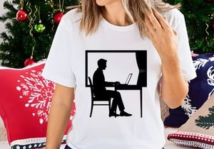 Freelancer working on laptop by sunny window at home office