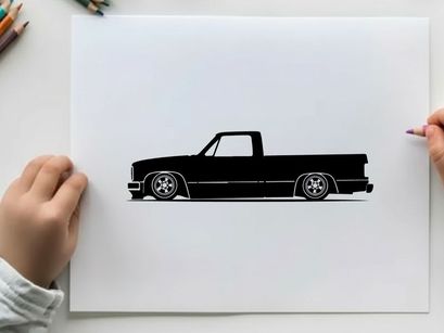 Silhouette of a classic lowered pickup truck in black