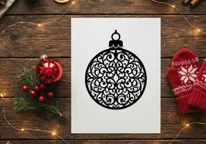 Decorative Christmas ornament with intricate black filigree design