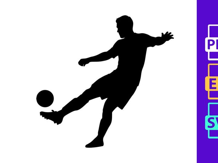 Silhouette of a soccer player kicking a ball in mid action