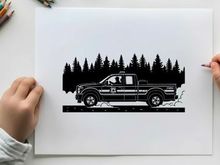 Silhouette of a pickup truck driving on a snowy road with trees