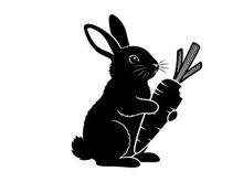 Silhouette of a rabbit holding a large carrot