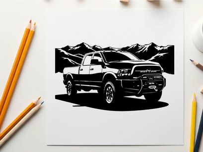 Silhouette of a pickup truck in front of mountains