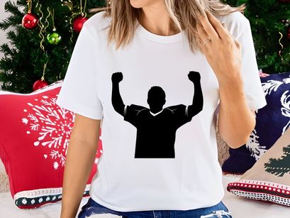 A person celebrating with arms raised in triumph and victory