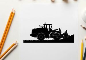 Silhouette of a large construction vehicle with a scoop