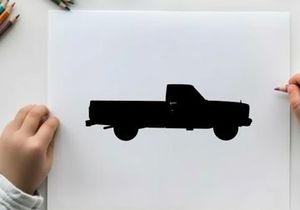 Silhouette of a classic pickup truck against a white background