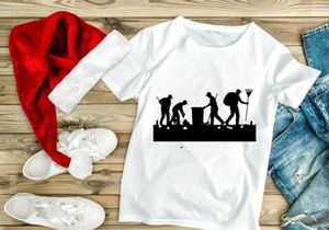 Silhouette of people cleaning up trash and debris in a park or public area