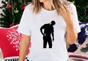 A man clutching his lower back in pain or discomfort