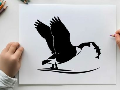 Silhouette of a bird catching a fish in mid air
