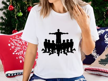 Silhouette of a man standing with arms outstretched surrounded by kneeling figures