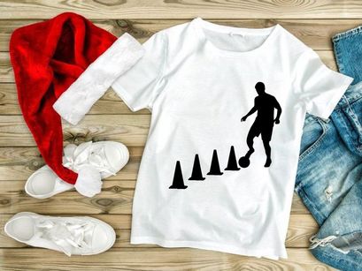 Soccer player skillfully navigating through cones in training session