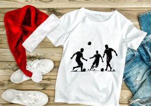 Silhouette of three soccer players in action kicking balls