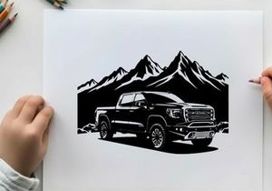 Silhouette of a pickup truck in front of mountains